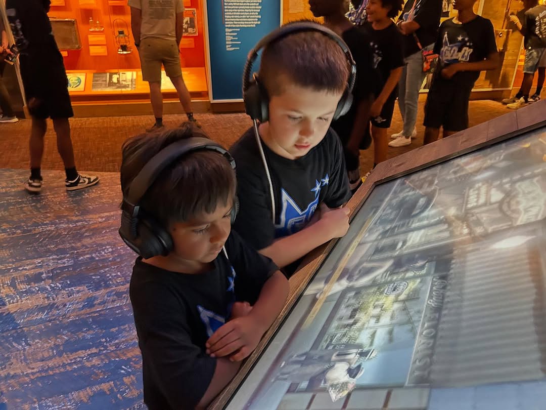 ELW youth exploring an exhibit at the National Museum of African American Music